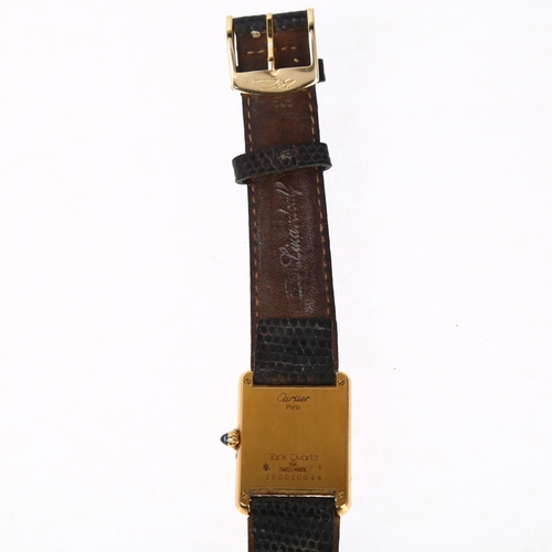 1010 - CARTIER - an 18ct gold Tank calendar moonphase quartz wristwatch, circa 1990s, rectangular silvered ... 