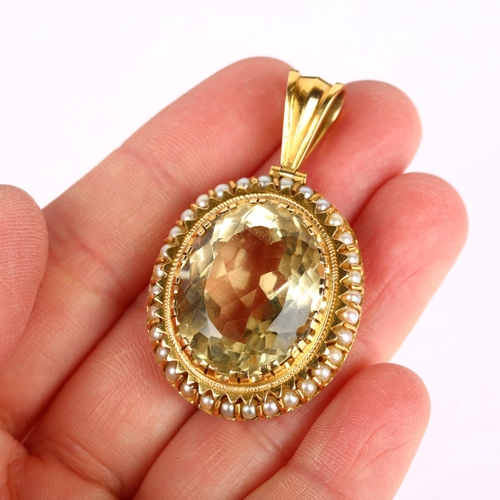 1108 - A 14ct gold citrine and whole pearl oval cluster pendant, centrally claw set with 27ct oval mixed-cu... 