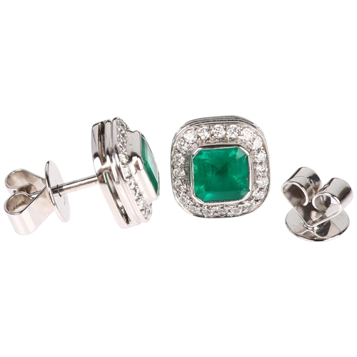 1112 - A pair of 18ct white gold emerald and diamond square cluster earrings, each set with an octagonal st... 