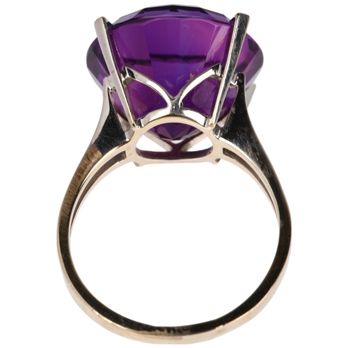 1118 - An 18ct white gold solitaire amethyst ring, claw set with 15ct round step-cut amethyst, amethyst wei... 