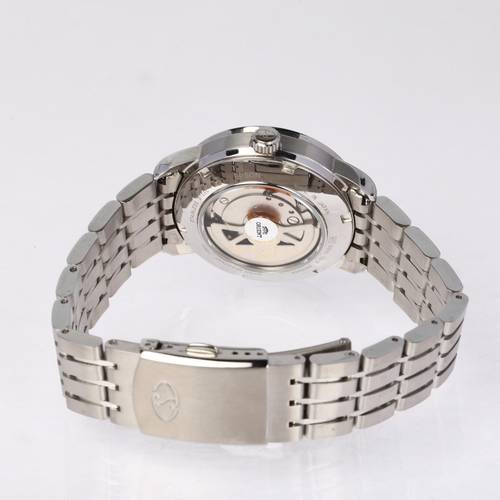 1030 - ORIENT - a stainless steel Orient Star automatic calendar bracelet watch, ref. DE00-C0-B, cream dial... 