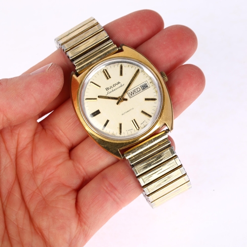 1037 - BULOVA - a gold plated stainless steel Ambassador automatic calendar bracelet watch, ref. 7532-1, br... 