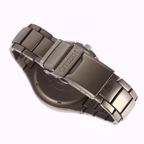 1056 - CITIZEN - a titanium Eco-Drive Skyhawk quartz chronograph bracelet watch, ref. C650-Q02497, black di... 