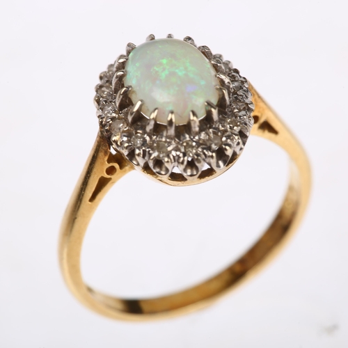 1141 - An 18ct gold opal and diamond oval cluster ring, claw set with 0.75ct oval cabochon opal surrounded ... 