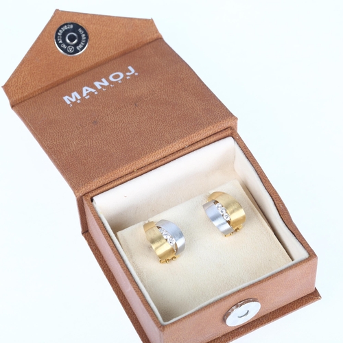 1154 - A pair of 18ct two-colour gold diamond half hoop earrings, by Manoj Jewellers, brushed settings, cha... 