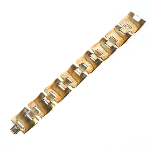 1161 - A heavy 18ct gold panel bracelet, maker LAO, import London 1975, concave and convex links, 18cm, 44.... 