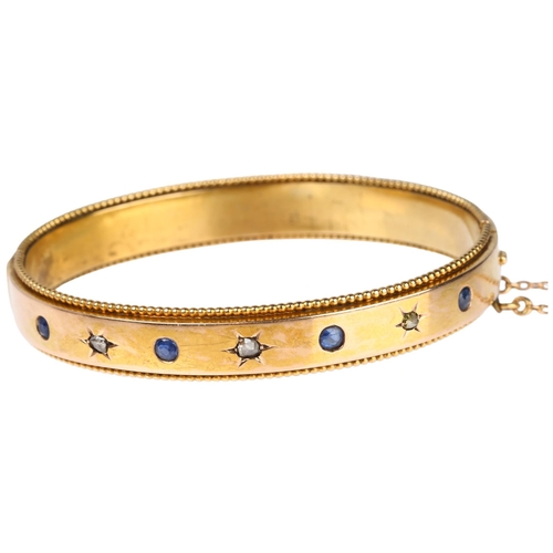 1163 - A French gold sapphire and diamond hinged bangle, maker AR, star set with rose-cut diamonds and roun... 