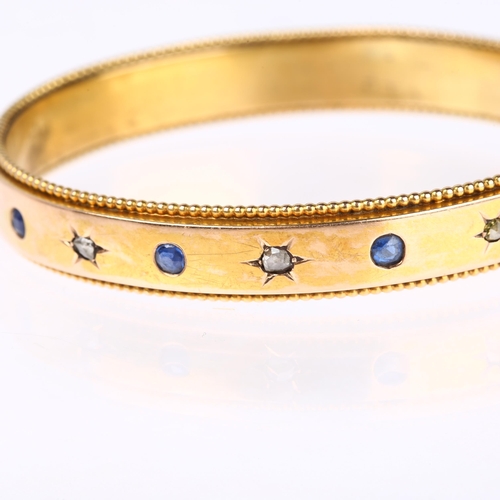 1163 - A French gold sapphire and diamond hinged bangle, maker AR, star set with rose-cut diamonds and roun... 