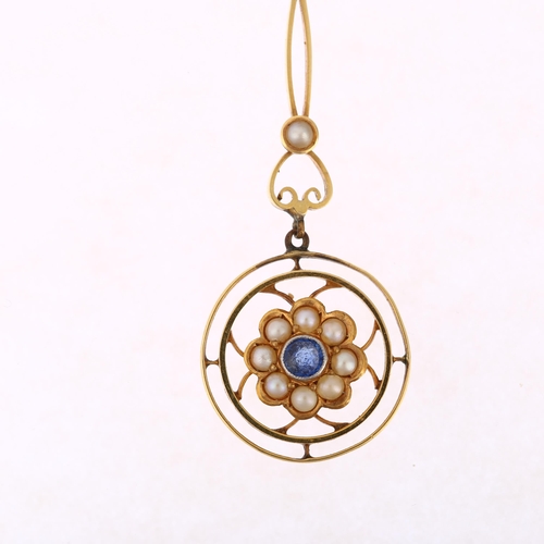 1164 - An Edwardian sapphire and pearl openwork drop pendant, gold settings with central flowerhead motif, ... 