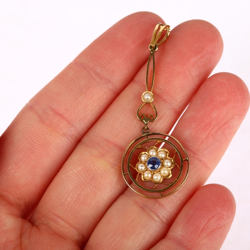 1164 - An Edwardian sapphire and pearl openwork drop pendant, gold settings with central flowerhead motif, ... 