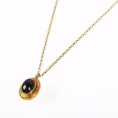 1174 - A Victorian 15ct gold garnet memorial locket pendant necklace, the central foil-back oval cabochon g... 