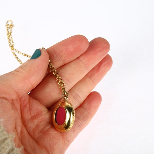 1174 - A Victorian 15ct gold garnet memorial locket pendant necklace, the central foil-back oval cabochon g... 