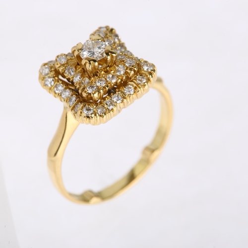 1186 - A late 20th century 18ct gold diamond cluster ring, import London 1980, square stepped wavy form, pa... 