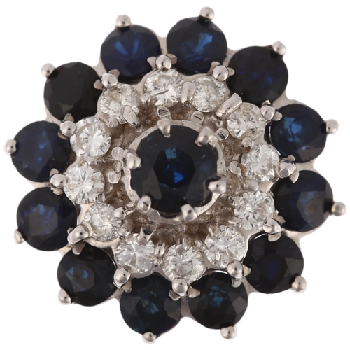 1194 - An 18ct white gold sapphire and diamond flowerhead cluster ring, set with round-cut sapphires and mo... 