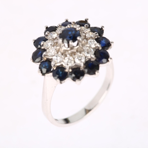 1194 - An 18ct white gold sapphire and diamond flowerhead cluster ring, set with round-cut sapphires and mo... 