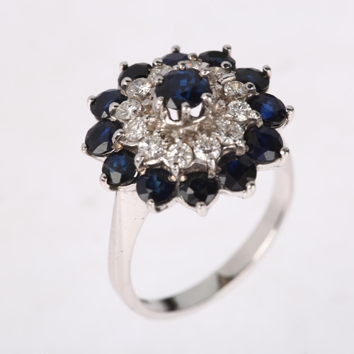 1194 - An 18ct white gold sapphire and diamond flowerhead cluster ring, set with round-cut sapphires and mo... 