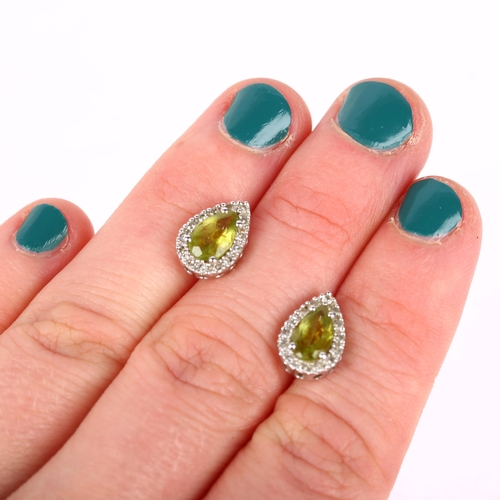 1195 - A pair of 9ct white gold peridot and diamond pear cluster earrings, set with pear-cut peridots and s... 