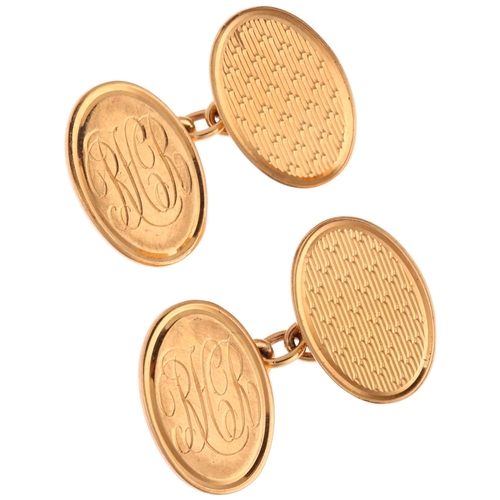 1198 - A pair of 9ct gold oval cufflinks, maker SB, with engine turned decoration, 18.8mm, 14.1g