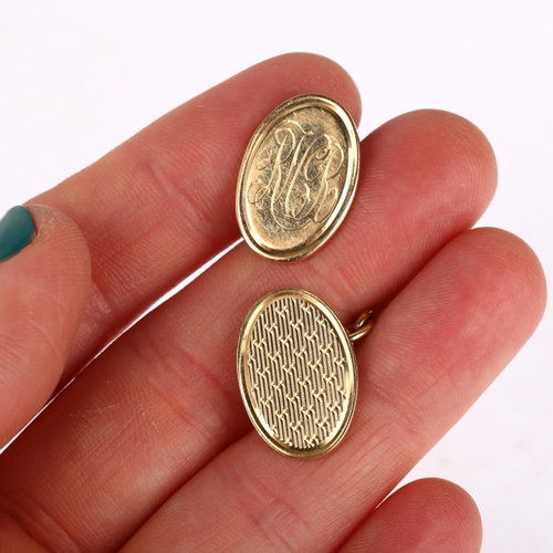 1198 - A pair of 9ct gold oval cufflinks, maker SB, with engine turned decoration, 18.8mm, 14.1g