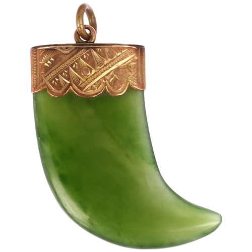 1264 - A Victorian nephrite tiger claw pendant, unmarked yellow metal engraved mount, 34.8mm, 7.2g