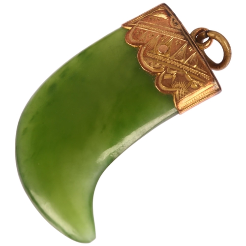 1264 - A Victorian nephrite tiger claw pendant, unmarked yellow metal engraved mount, 34.8mm, 7.2g