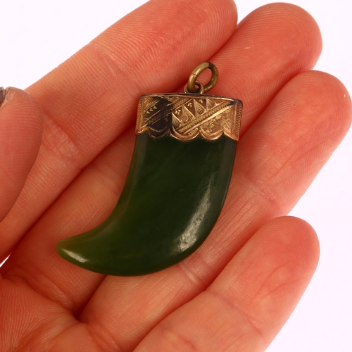 1264 - A Victorian nephrite tiger claw pendant, unmarked yellow metal engraved mount, 34.8mm, 7.2g