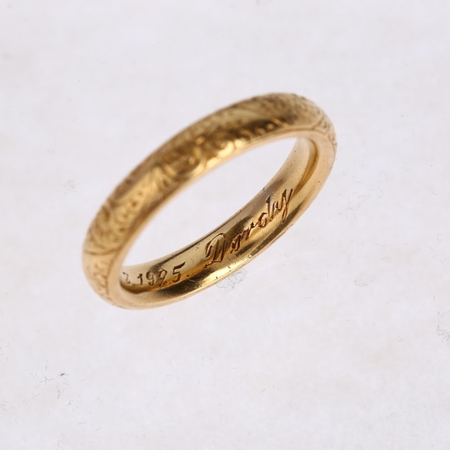 1212 - A heavy early 20th century 18ct gold wedding band ring, maker WJP, London 1913, with engraved foliat... 