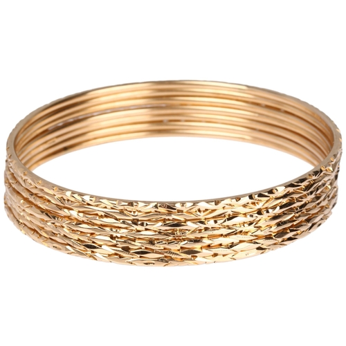 1216 - A set of 7 x 14ct gold slave bangles with engraved decoration, each band width 1.9mm, internal circu... 