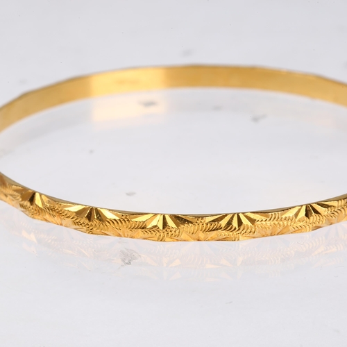 1218 - A Middle Eastern high carat gold slave bangle, band width 4mm, internal circumference 20cm, 15.4g