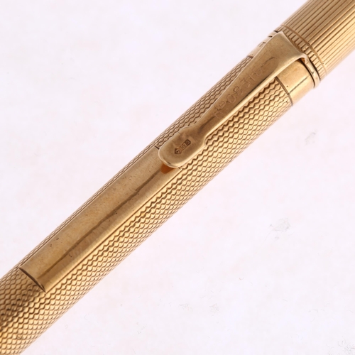 1220 - SAMPSON MORDAN & CO - an Art Deco 9ct gold Everpoint propelling pencil, London 1928, engine turned a... 