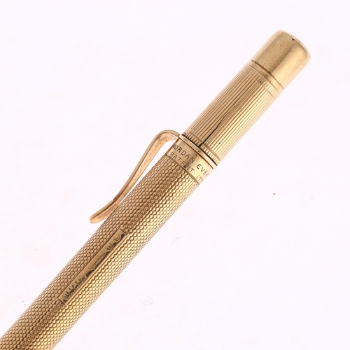 1220 - SAMPSON MORDAN & CO - an Art Deco 9ct gold Everpoint propelling pencil, London 1928, engine turned a... 