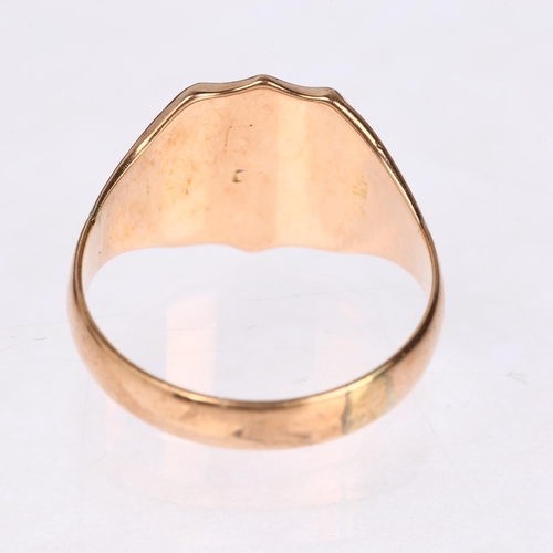 1225 - An early 20th century 9ct rose gold shield signet ring, engraved with initials MW, indistinct hallma... 