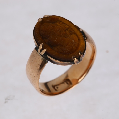 1235 - An Antique 9ct rose gold tigers eye signet ring, maker CD, relief carved depicting female profile, s... 