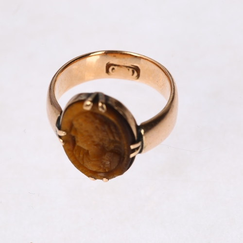 1235 - An Antique 9ct rose gold tigers eye signet ring, maker CD, relief carved depicting female profile, s... 