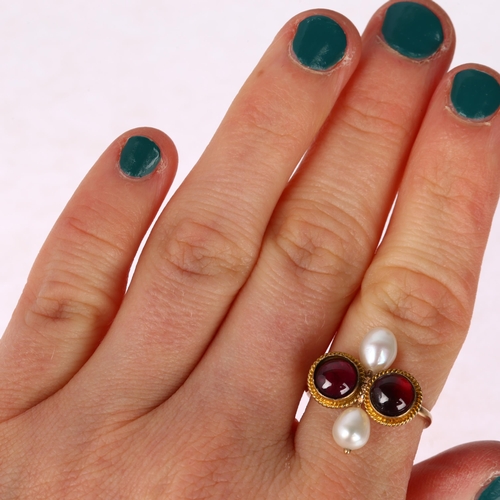 1248 - An Antique garnet and pearl Toi et Moi ring, unmarked gold closed-back settings with round cabochon ... 