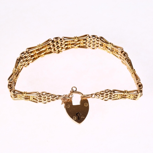 1249 - An early 20th century 9ct gold gatelink bracelet, with 9ct heart padlock clasp, 18cm, 18.1g