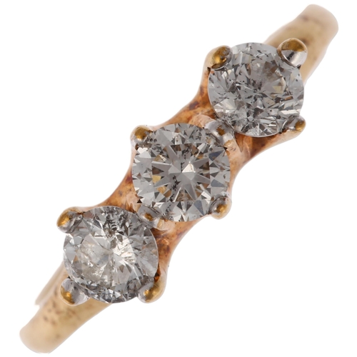 1250 - A modern 9ct gold three stone diamond ring, claw set with modern round brilliant-cut diamonds, total... 