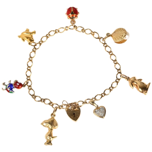 1251 - A modern 9ct gold flat curb link charm bracelet with 7 x 9ct charms, 18ct, 9.6g gross