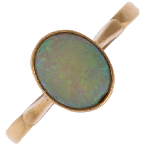 1252 - A late 20th century solitaire opal ring, unmarked gold settings with rub-over set oval cabochon opal... 