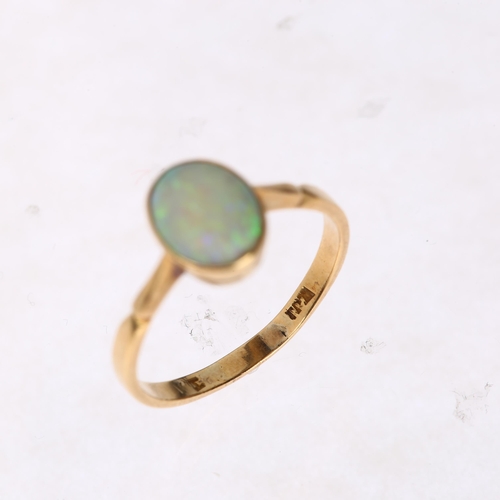 1252 - A late 20th century solitaire opal ring, unmarked gold settings with rub-over set oval cabochon opal... 