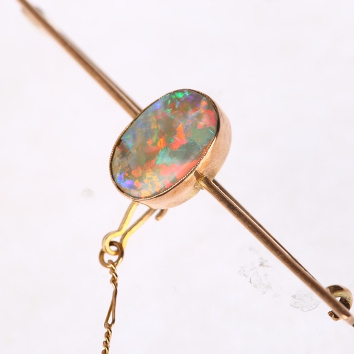 1253 - An early 20th century 9ct rose gold opal bar brooch, rub-over set with oval flat cabochon opal measu... 