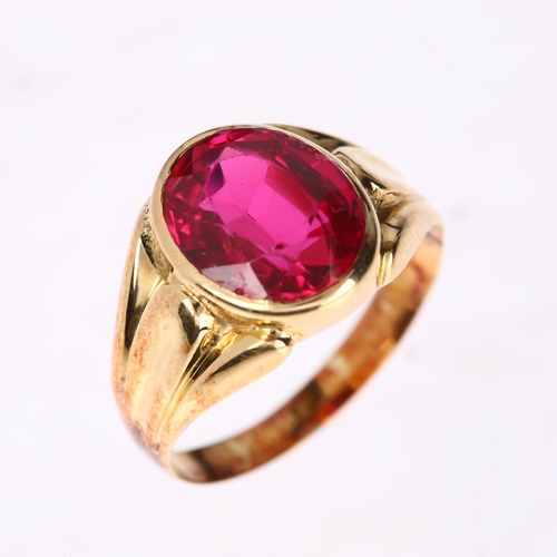 1257 - A synthetic ruby signet ring, unmarked gold settings, rub-over set with oval mixed-cut synthetic rub... 