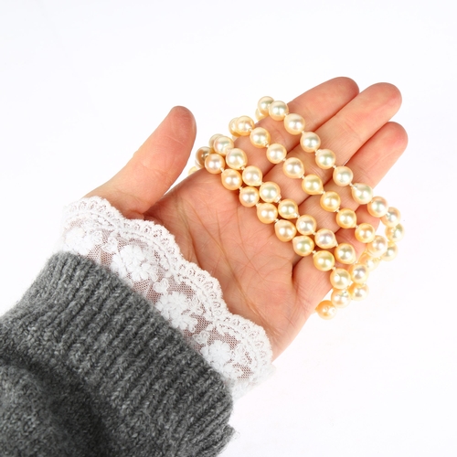 1258 - A single-strand cultured pearl bead necklace, with 9ct gold diamond clasp, 7.7mm pearls, 88cm, 65.5g