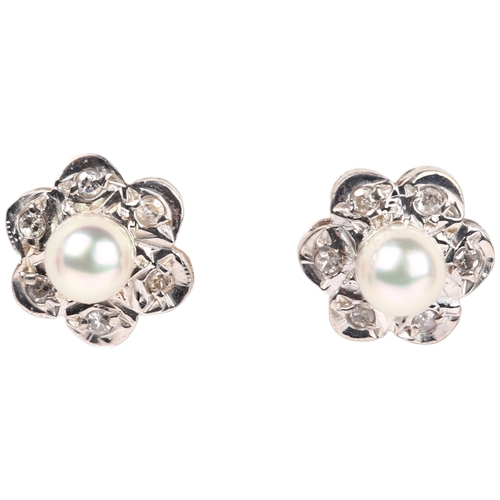 1259 - A pair of 9ct gold whole cultured pearl and diamond flowerhead cluster earrings, London 1978, set wi... 