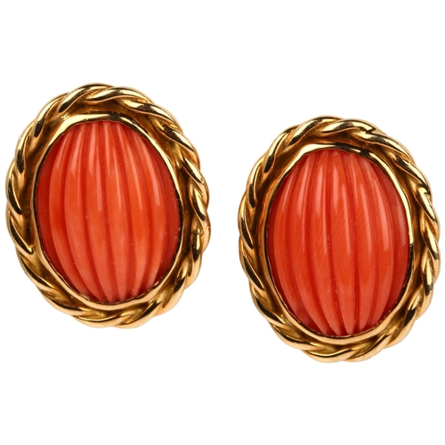 1263 - A pair of late 20th century 18ct gold coral earrings, maker's mark SUE, London 1980, set with rib-cu... 