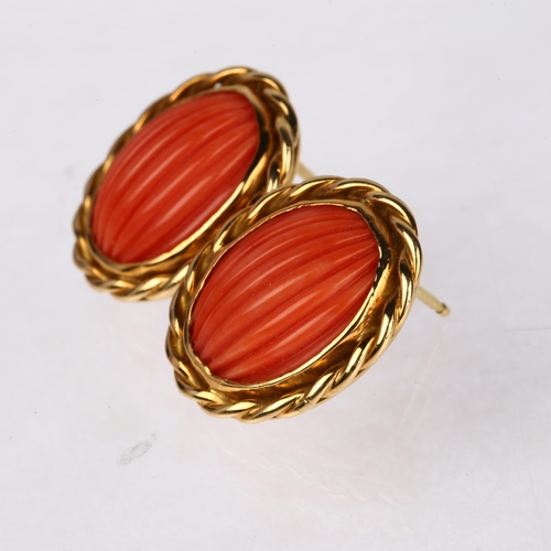 1263 - A pair of late 20th century 18ct gold coral earrings, maker's mark SUE, London 1980, set with rib-cu... 