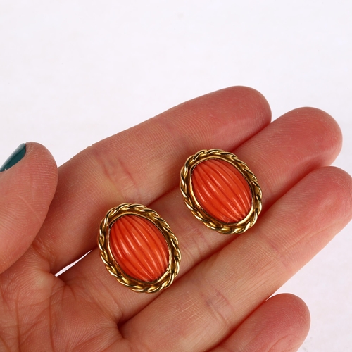 1263 - A pair of late 20th century 18ct gold coral earrings, maker's mark SUE, London 1980, set with rib-cu... 