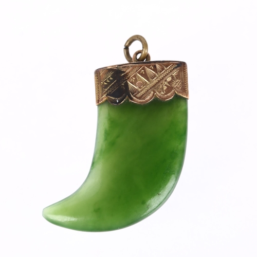 1264 - A Victorian nephrite tiger claw pendant, unmarked yellow metal engraved mount, 34.8mm, 7.2g