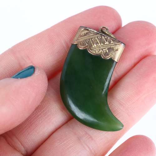 1264 - A Victorian nephrite tiger claw pendant, unmarked yellow metal engraved mount, 34.8mm, 7.2g