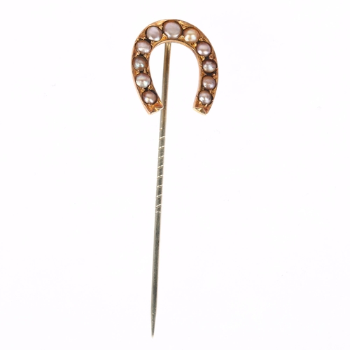 1275 - A Victorian split pearl horseshoe stickpin, unmarked yellow metal settings, head 21.2mm, overall 65.... 